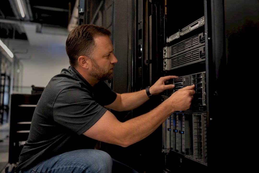 Engineer inspecting server hardware