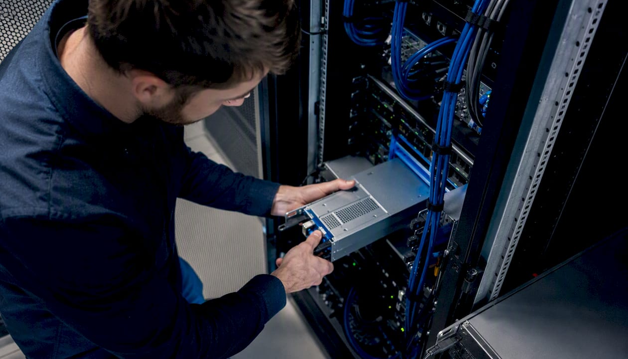 IT technician replacing server hardware part