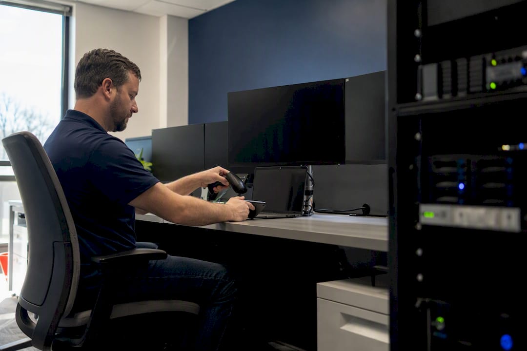 Hands performing security check in cloud monitoring center